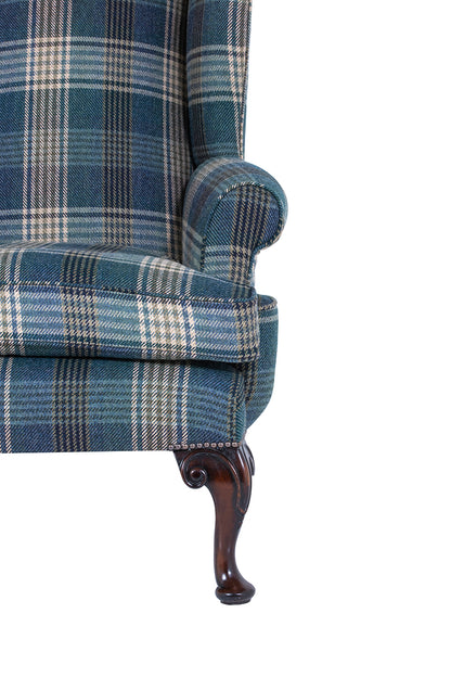 acanthus leg and scroll arm on a wingchair with tartan fabric 