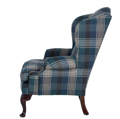 acanthus leg on a hand upholstered wingchair 