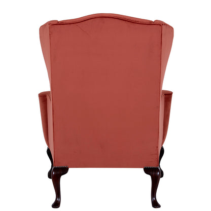 nailed mahogany wingchair in velvet fabric