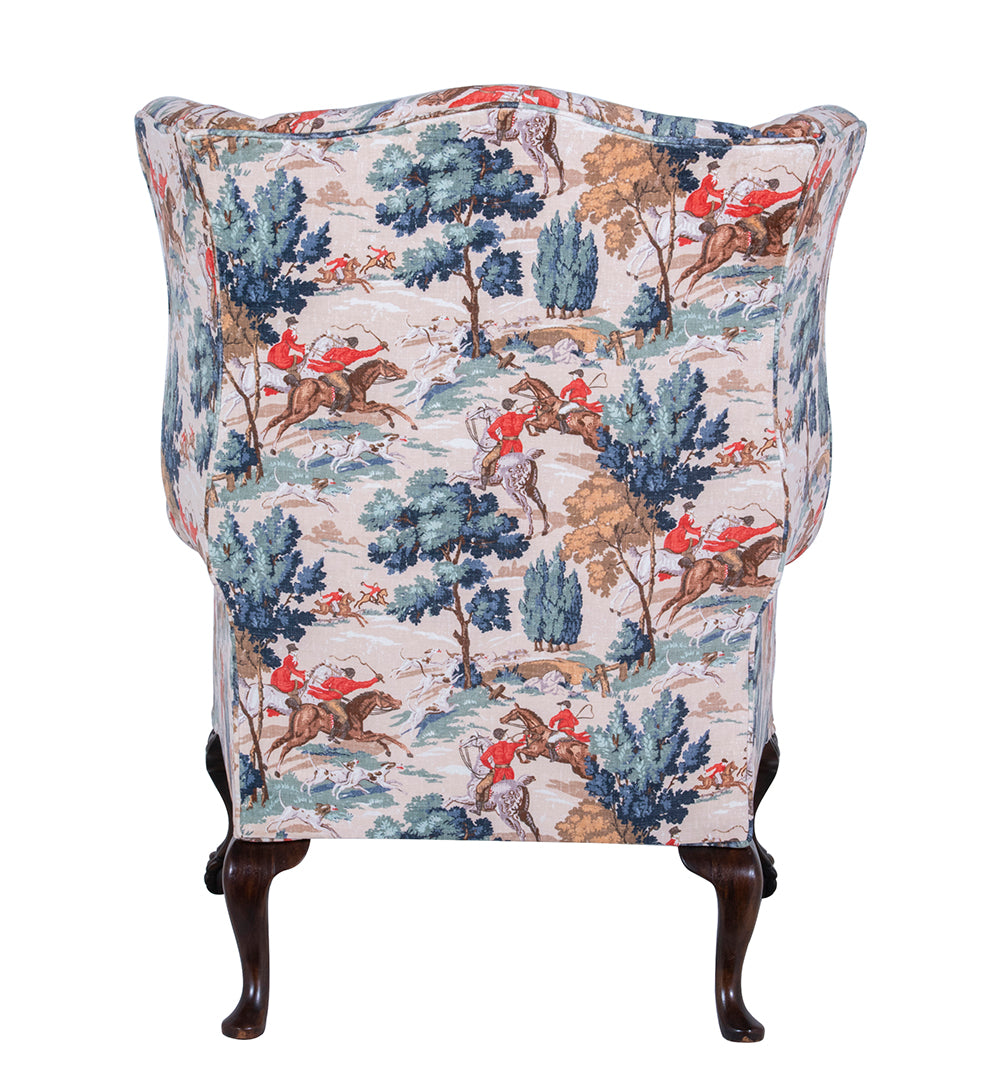 back of wingchair with horses hunting fabric