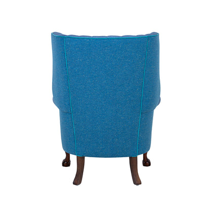 back of a blue wingbacked chair from brights of nettlebed