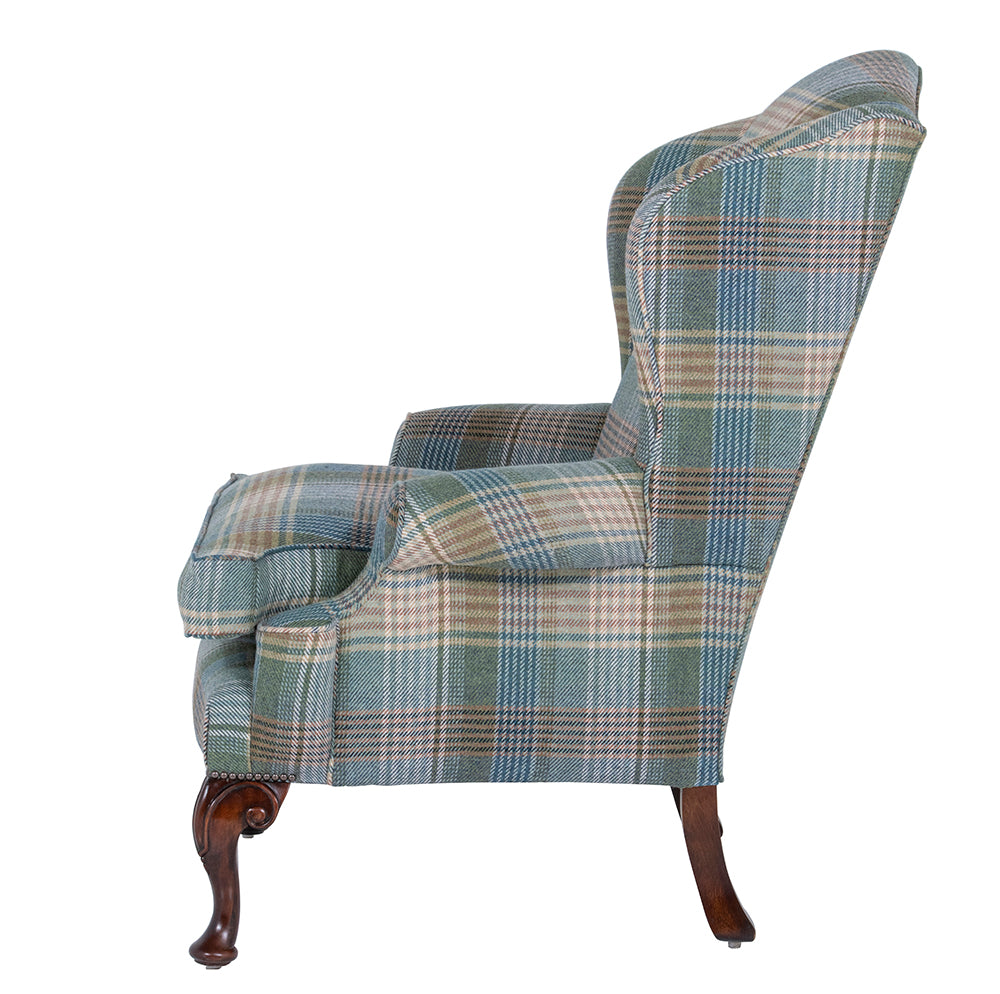 acanthus leg on a hand upholstered wingchair 