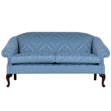 a blue traditional english sofa