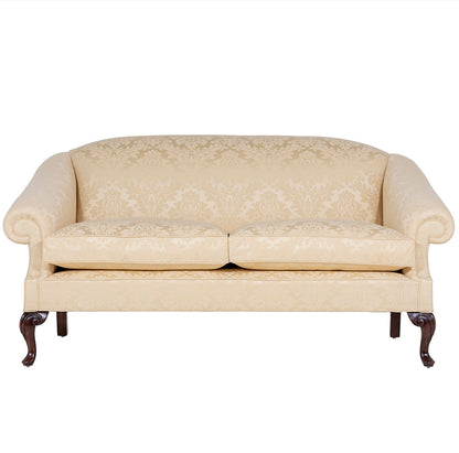 A yellow damask traditional english sofa