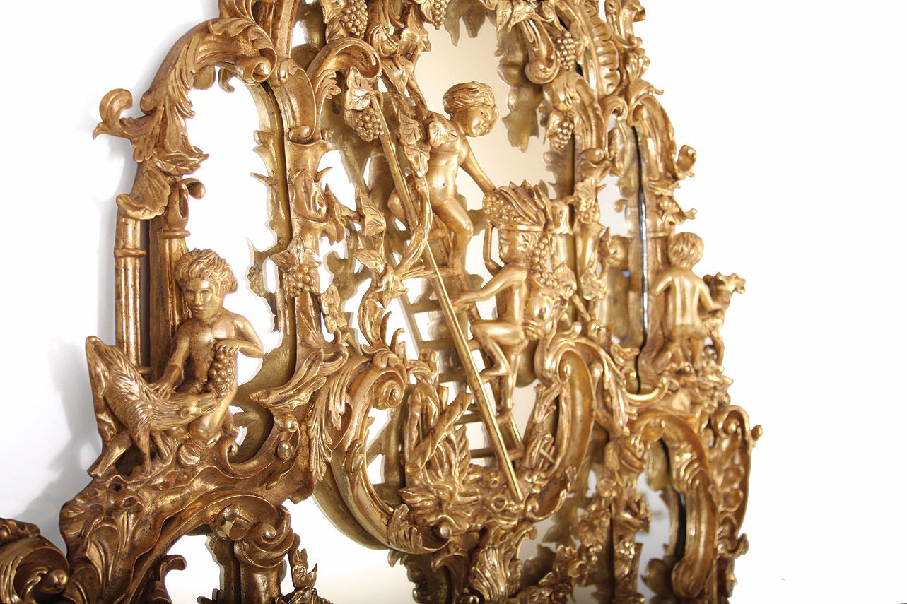 This magnificent Thomas Johnson Gilt Mirror is hand carved on solid mahogany and gilded in gold leaf.  